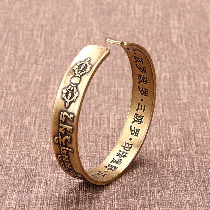 Bracelet de guérison en cuivre et laiton avec Buddha Stones et mantra tibétain Mahāpratisarā sanskrit
