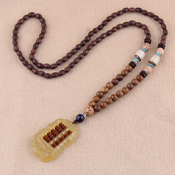 Collier pendentif en Buddha Stones tibétain en bois de wengé Bodhi Seed Agate Balance Peace