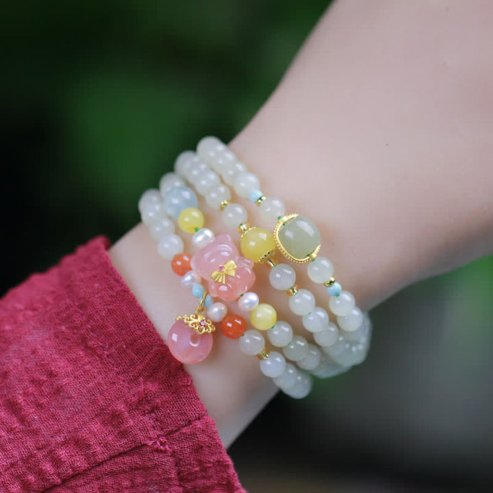 Bracelet en Buddha Stones en jade Hetian naturel avec cristal rose et boucle de paix pour le bonheur et l'abondance