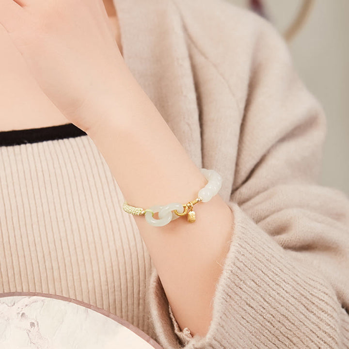Bracelet tressé en perles de jade Hetian naturelles de Buddha Stones avec boucle de paix double et caractère Fu