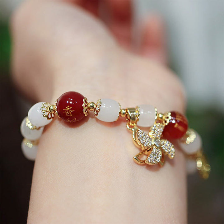 Bracelet de bénédiction avec breloque en forme de moulin à vent en Buddha Stones et caractère Fu