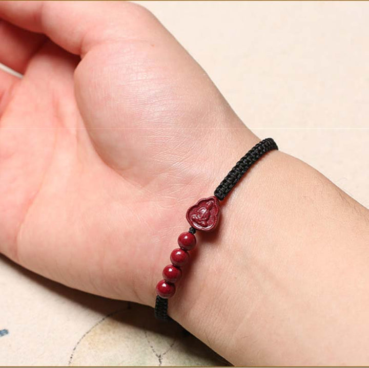 Bracelet en cordon de bénédiction en cinabre Bouddha rieur Avalokitesvara de Buddha Stones