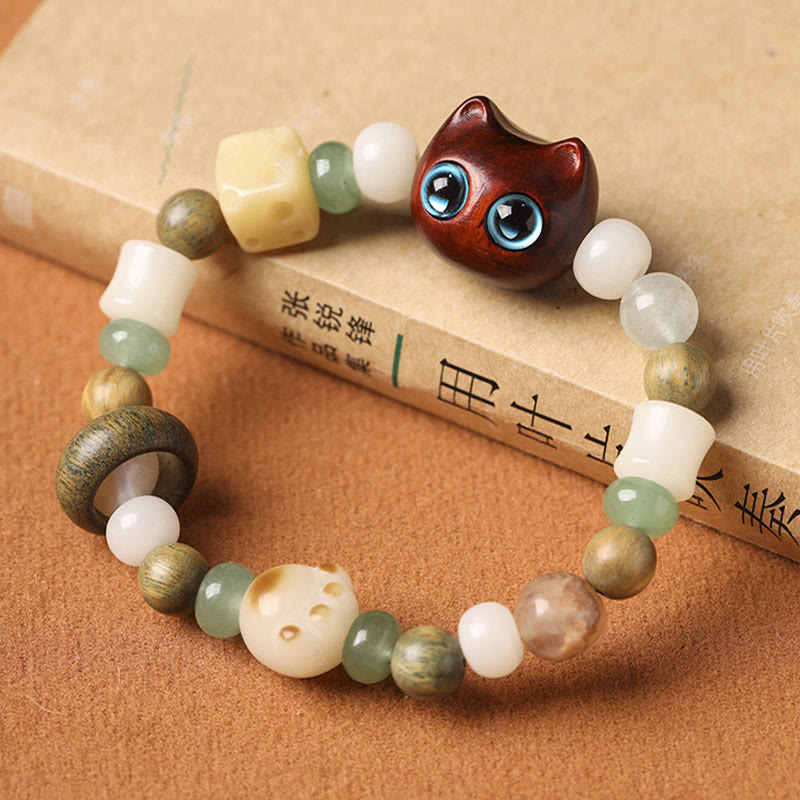 Buddha Stones Graine de Bodhi Bois de santal vert Bois d'ébène Petite feuille Bois de santal rouge Tête de chat Patte Griffe Bracelet de paix - image 11