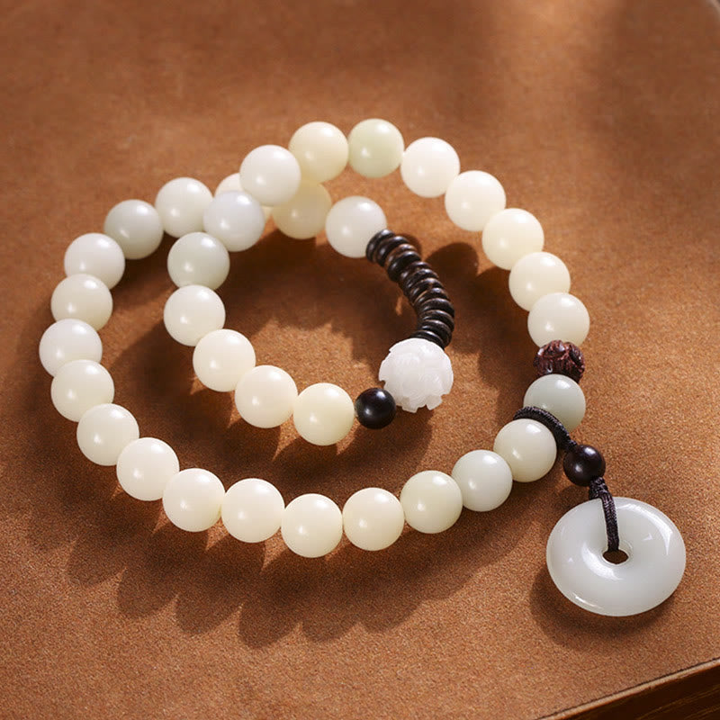 Bracelet double tour en harmonie avec boucle de paix en bois de santal vert et graines de Bodhi et Buddha Stones