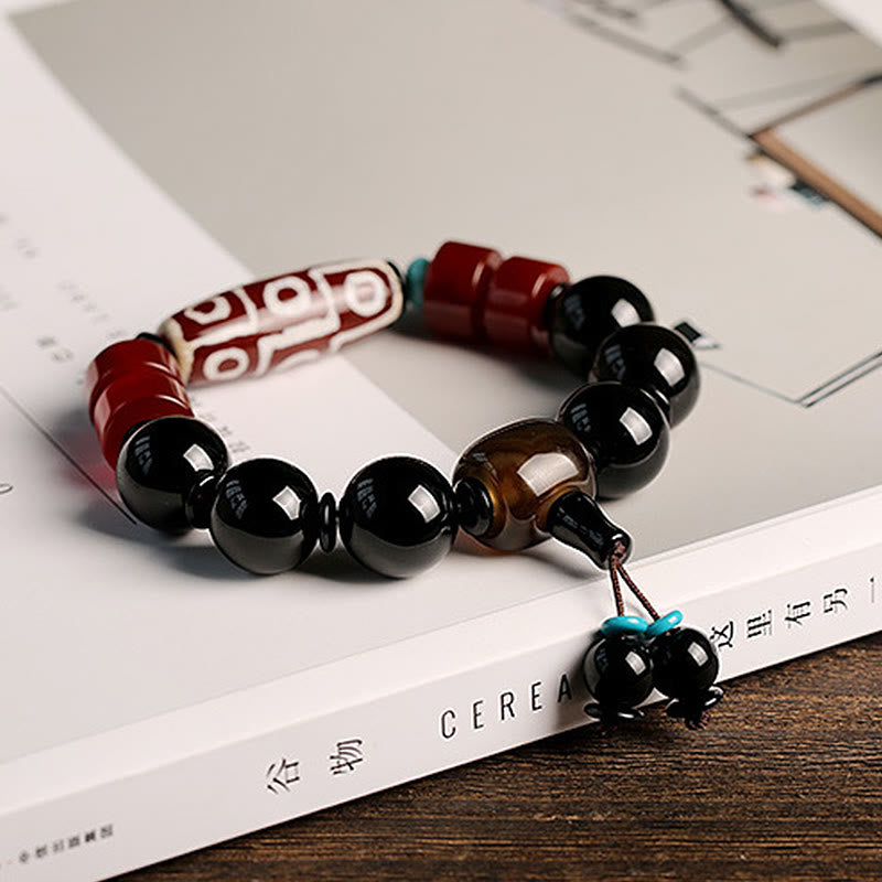 Bracelet tibétain de protection de richesse en onyx noir avec perles dzi à neuf yeux