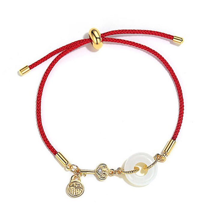 Bracelet en corde rouge avec boucle de paix en jade Hetian plaqué or 18 carats et Buddha Stones