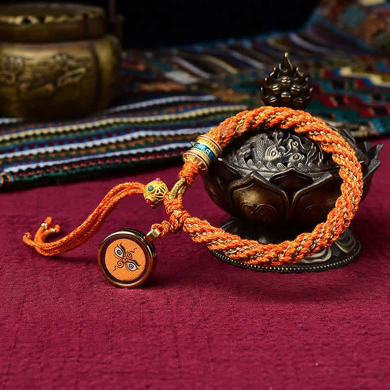 Bracelet tibétain en corde tressée avec breloque porte-bonheur Thangka en Buddha Stones