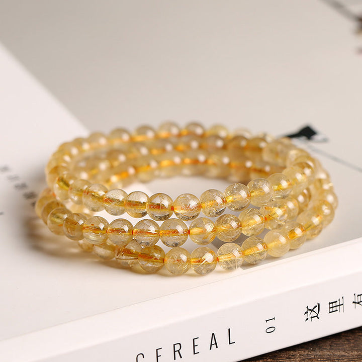 Bracelet de protection et de prospérité en Buddha Stones en citrine naturelle