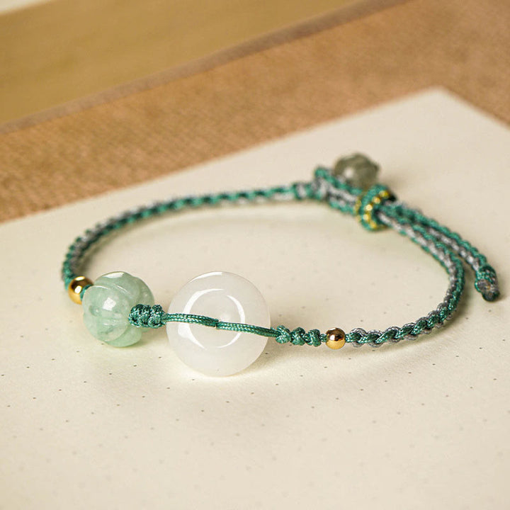 Bracelet tressé en jade blanc avec boucle de paix et perles citrouilles et Buddha Stones