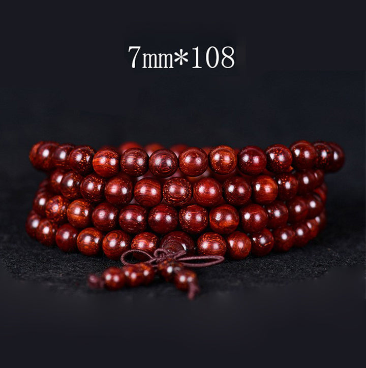 Bracelet d'équilibre tibétain en petites feuilles de santal rouge avec Buddha Stones