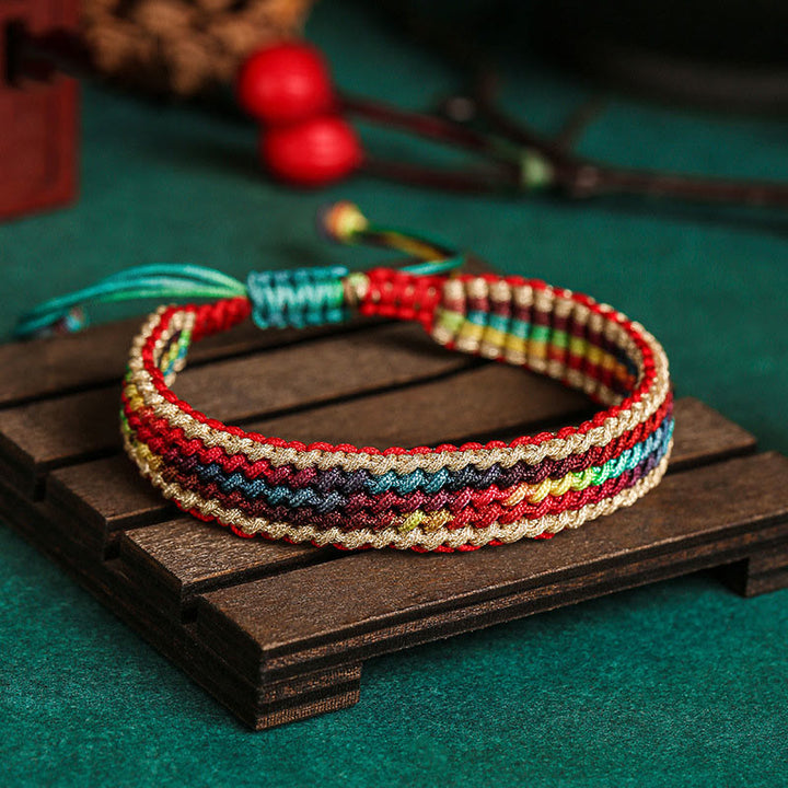 Bracelet tressé de protection multicolore arc-en-ciel fait main en Buddha Stones tibétaines