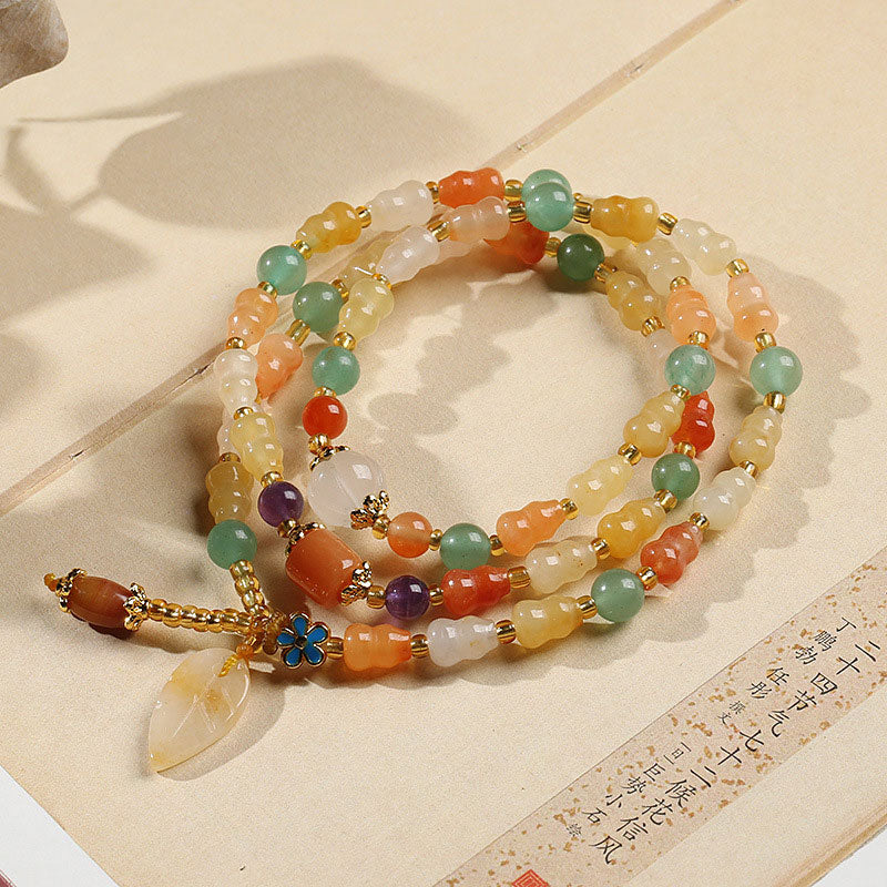 Bracelet de richesse en jade et soie dorée avec Buddha Stones
