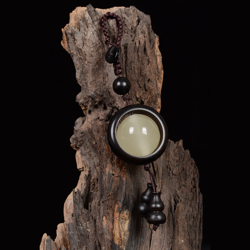 Porte-clés porte-bonheur lumineux en Buddha Stones en bois de santal rouge et bois d'ébène en bois de santal vert