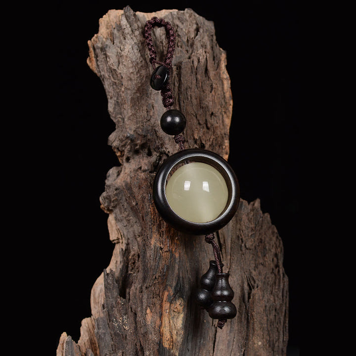 Porte-clés porte-bonheur lumineux en Buddha Stones en bois de santal rouge et bois d'ébène en bois de santal vert