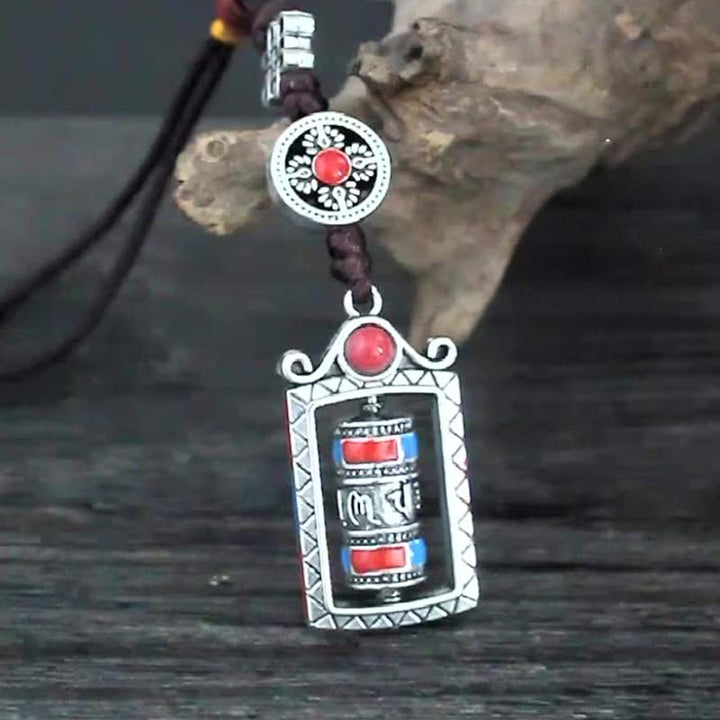 Porte-clés décoratif avec nœud rotatif et bénédiction en forme de roue de prière en six mots vrais en Buddha Stones