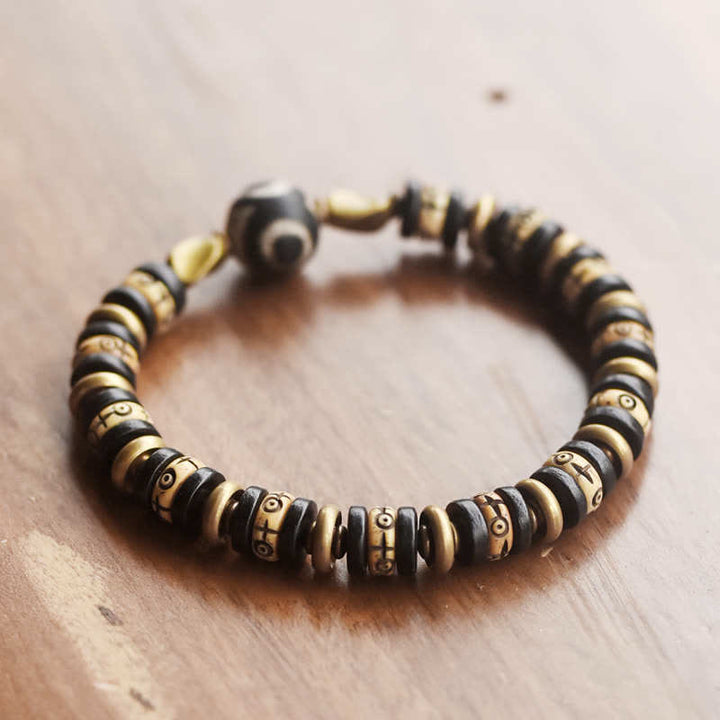 Bracelet de force en bois d'ébène et perles d'os tibétaines en Buddha Stones