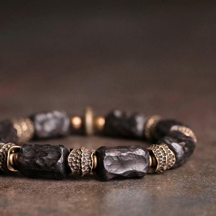 Bracelet tibétain en bois d'ébène et cuivre avec Buddha Stones pour la paix et le calme