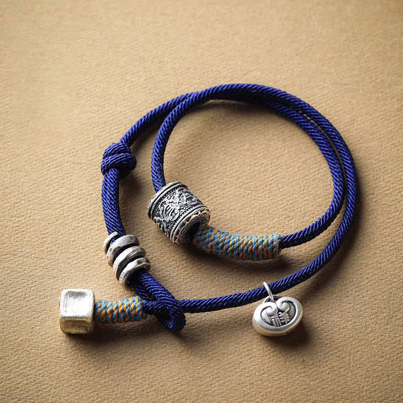 Bracelet en corde double enroulé en Buddha Stones fait à la main avec amulette de bon augure sculptée Om Mani Padme Hum