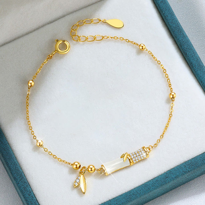 Bracelet porte - bonheur en argent sterling 925 plaqué or 18 carats avec jade blanc et bambou et zircon - image 1