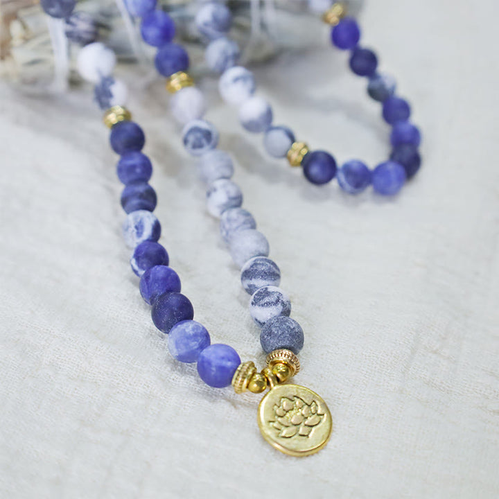 Bracelet Mala avec pendentif lotus en 108 perles de jaspe Picasso naturel et pierre bleue Buddha Stones