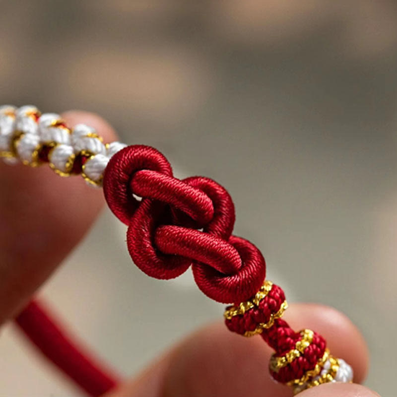 Bracelet porte-bonheur en corde avec breloque en fleur de pêcher et nœud d'amour véritable fait à la main par Buddha Stones
