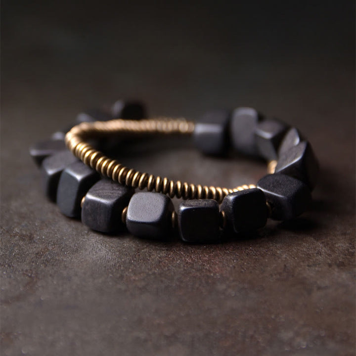 Bracelet double tour en cuivre et bois d'ébène tibétain avec Buddha Stones