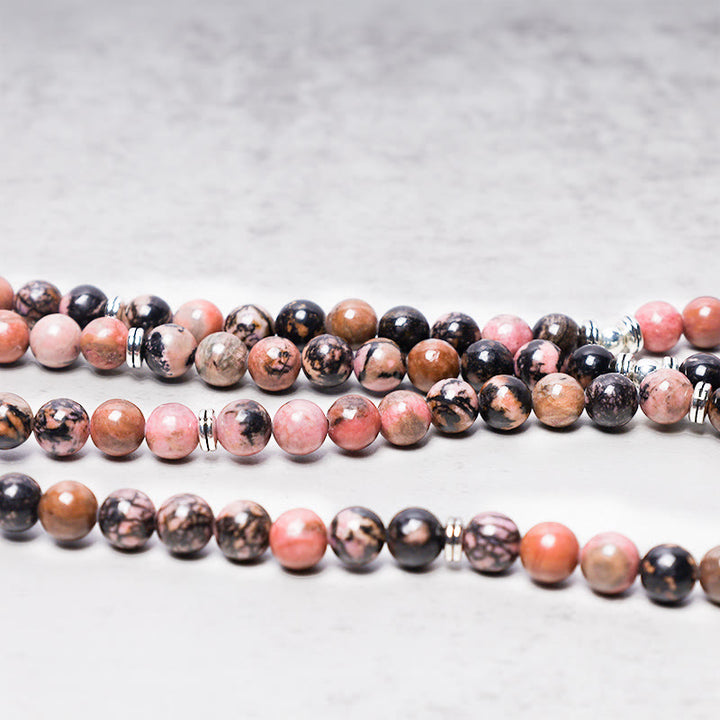 Bracelet Mala 108 Buddha Stones en rhodonite et lotus avec énergie de compassion