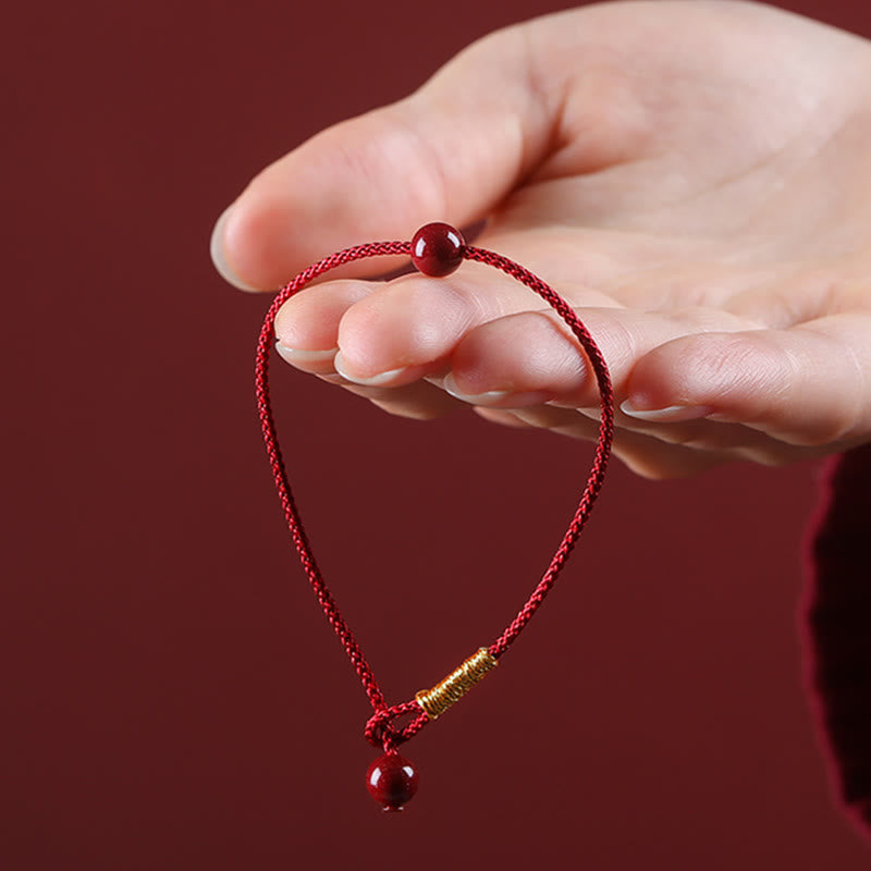 Bracelet en fil rouge avec bénédiction en agate rouge cinabre naturelle de Buddha Stones