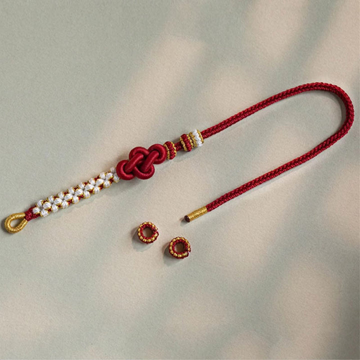 Bracelet porte-bonheur en corde avec breloque en fleur de pêcher et nœud d'amour véritable fait à la main par Buddha Stones