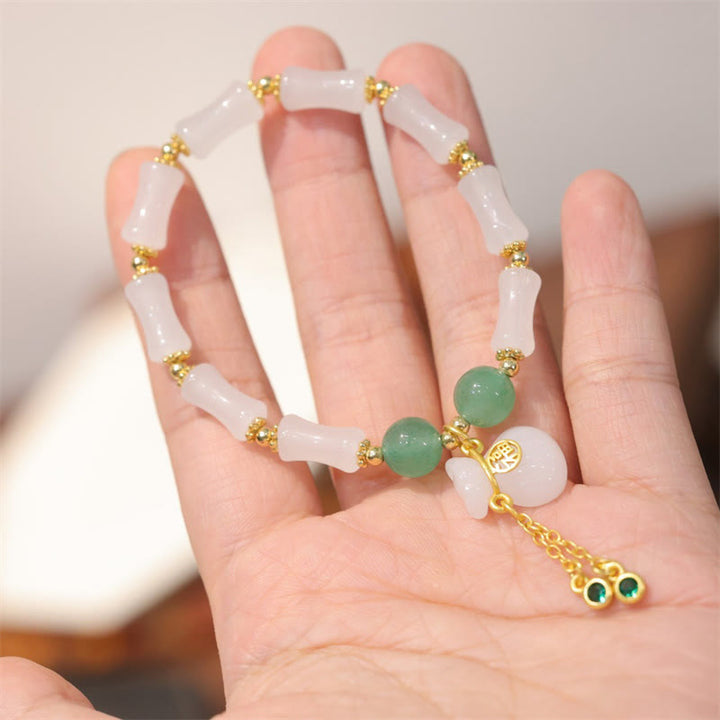 Bracelet en Buddha Stones en soie blanche naturelle dorée et bambou avec motif porte-bonheur et personnage Fu