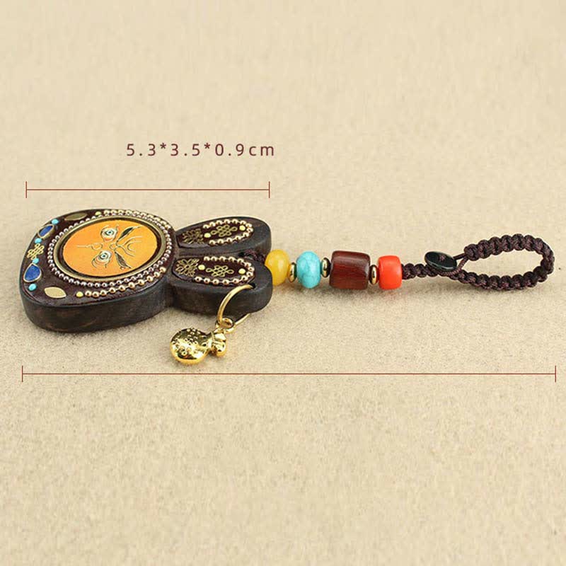 Porte-clés Thangka en ébène du Tibet représentant les cinq dieux de la richesse