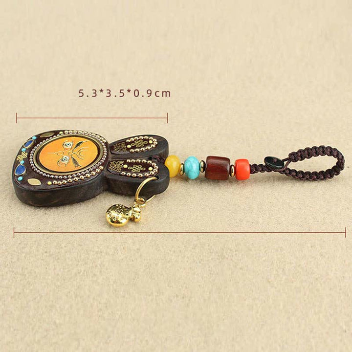 Porte-clés Thangka en ébène du Tibet représentant les cinq dieux de la richesse