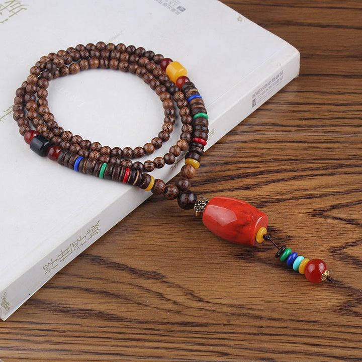 Collier pendentif en Buddha Stones tibétain en bois de wengé Bodhi Seed Agate Balance Peace