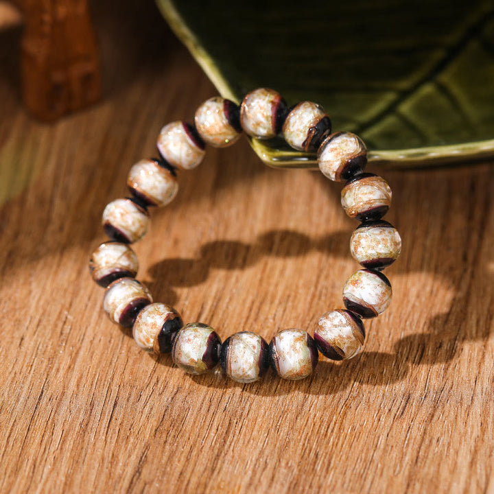 Bracelet tibétain classique en perles de verre Liuli avec Buddha Stones