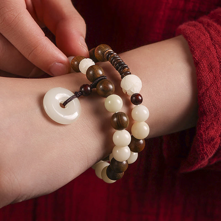 Bracelet double tour en harmonie avec boucle de paix en bois de santal vert et graines de Bodhi et Buddha Stones