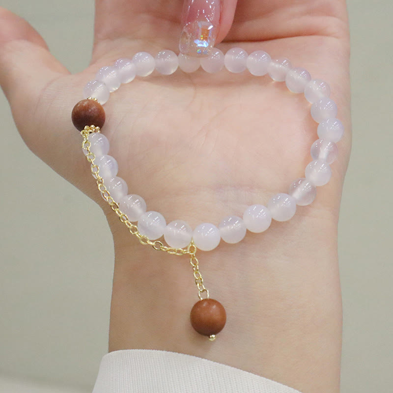 Bracelet de protection à breloques en bois de santal et œil de chat Fu avec Buddha Stones