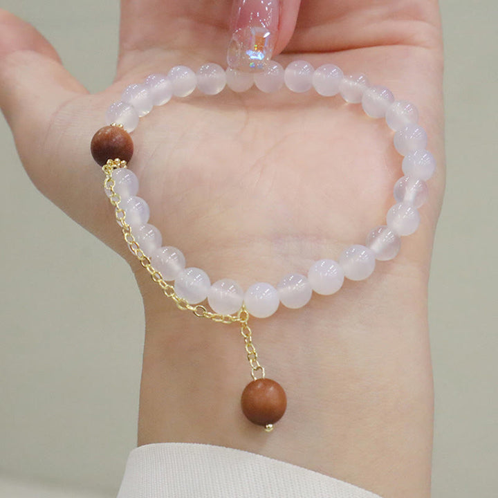 Bracelet de protection à breloques en bois de santal et œil de chat Fu avec Buddha Stones