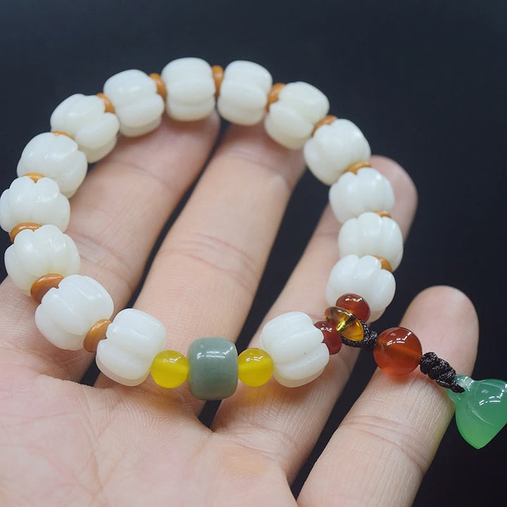 Bracelet en perles de citrouille gravées en agate rouge Bodhi Calme Harmonie Bodhi Graines naturelles Lotus