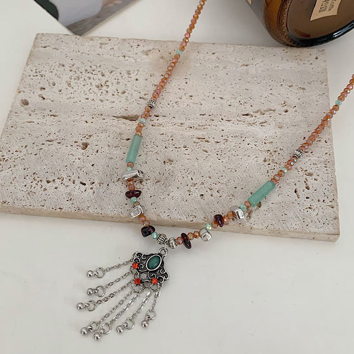 Collier pendentif pompon porte-bonheur en cuivre avec pierres de cristal tibétaines de Buddha Stones
