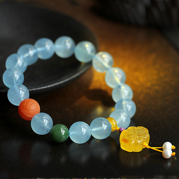 Bracelet de paix avec breloque en ambre et aigue-marine naturelle