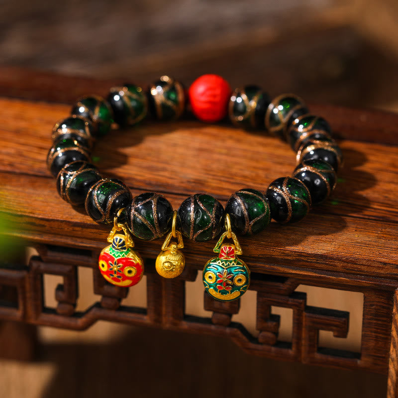 Bracelet de perles de cinabre colorées représentant une famille de bêtes avaleuses d'or