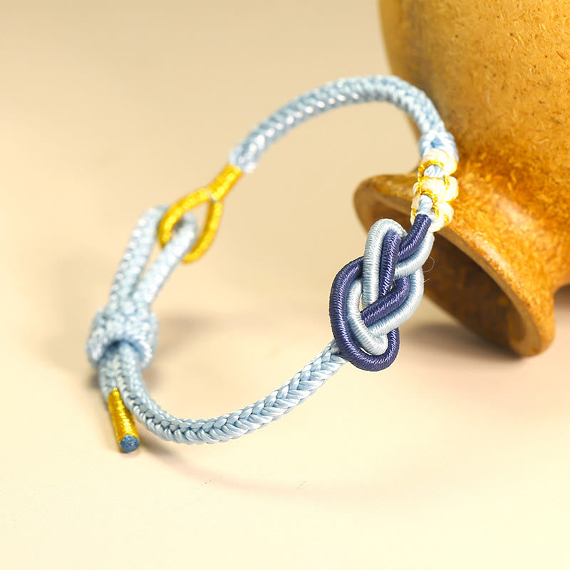 Bracelet de connexion porte-bonheur en forme de nœud de paix à huit fils fabriqué à la main par Buddha Stones
