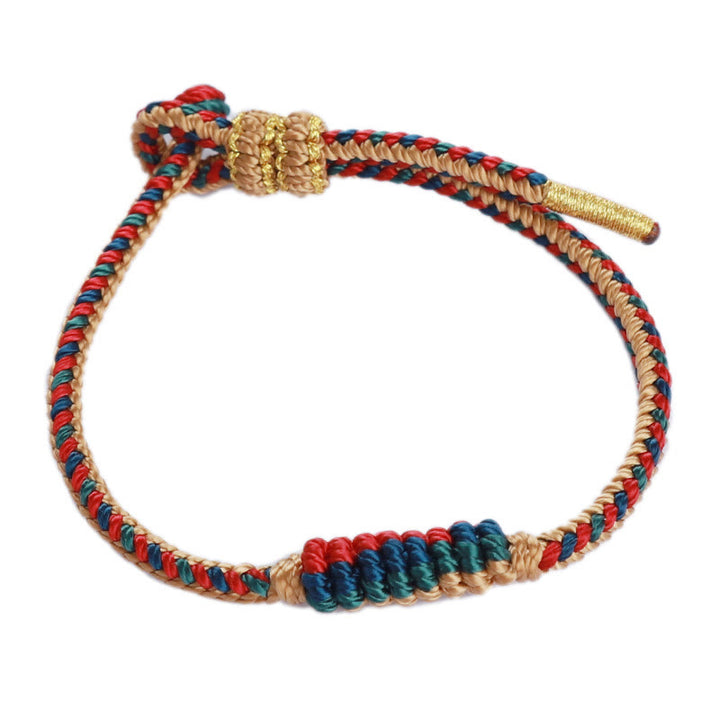 Bracelet de protection tressé à huit fils en Buddha Stones tibétain fait à la main avec roue de prière et nœud de paix