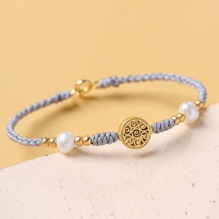 Bracelet tressé en corde bleue avec perles et arbre de fortune en cuivre et Buddha Stones
