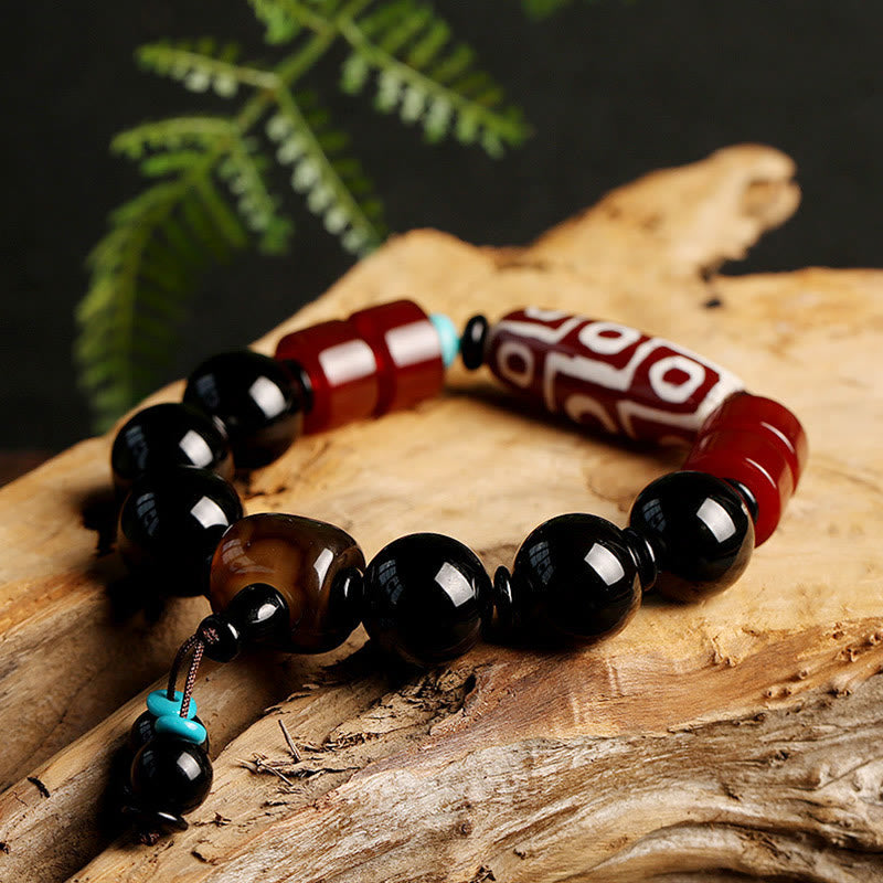 Bracelet tibétain de protection de richesse en onyx noir avec perles dzi à neuf yeux