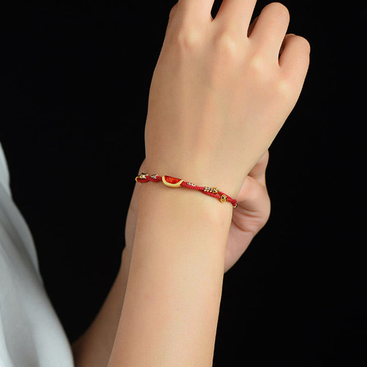 Bracelet en corde rouge tressée porte-bonheur en forme de boulettes de cinabre faites à la main par Buddha Stones