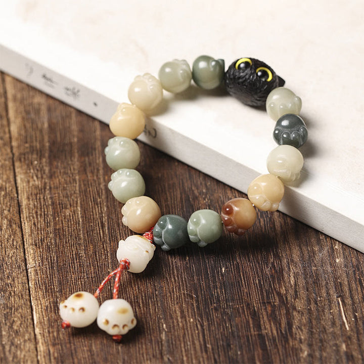 Bracelet de sagesse porte-bonheur en bois d'ébène avec de belles pattes et des graines de Bodhi naturelles de Buddha Stones - image 10