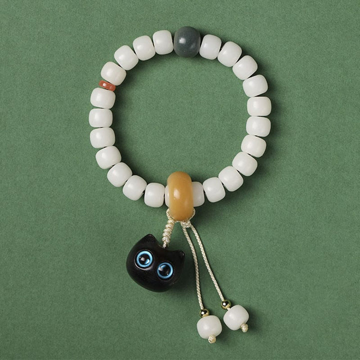 Bracelet en Buddha Stones en graines de Bodhi naturelles en bois noir africain avec joli chat et breloque pour la paix et l'harmonie - Graine de Bodhi du chat aux yeux bleus - image 6