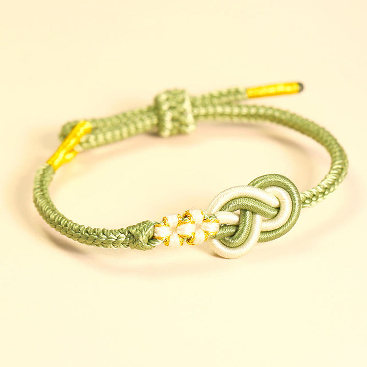 Bracelet de connexion porte-bonheur en forme de nœud de paix à huit fils fabriqué à la main par Buddha Stones