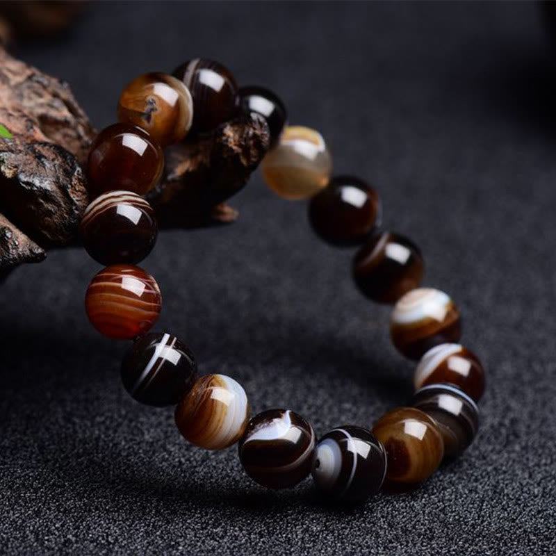 Bracelet de bonheur positif tibétain en sardonyx Buddha Stones